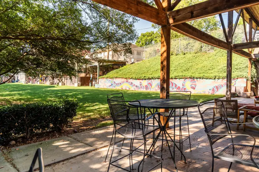 Outdoor patio with colorful mural wall